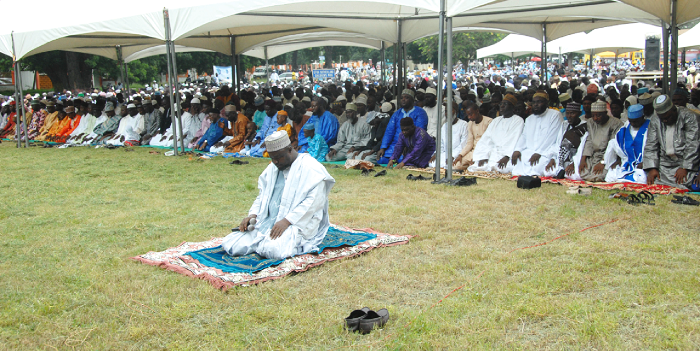 Mallam Munir Abdallah Tawfiq (front), first Deputy Chief Imam, leading the congregation through prayers during the annual Eid-ul-Fitr celebration at the Efua Sutherland Children's Park in Accra